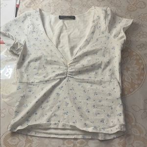 white brandy top with flowers